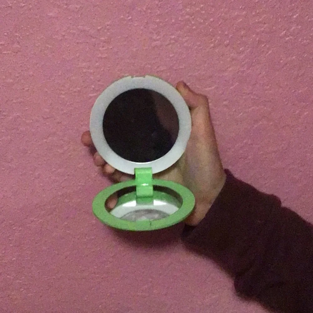 Portable charger with mirror